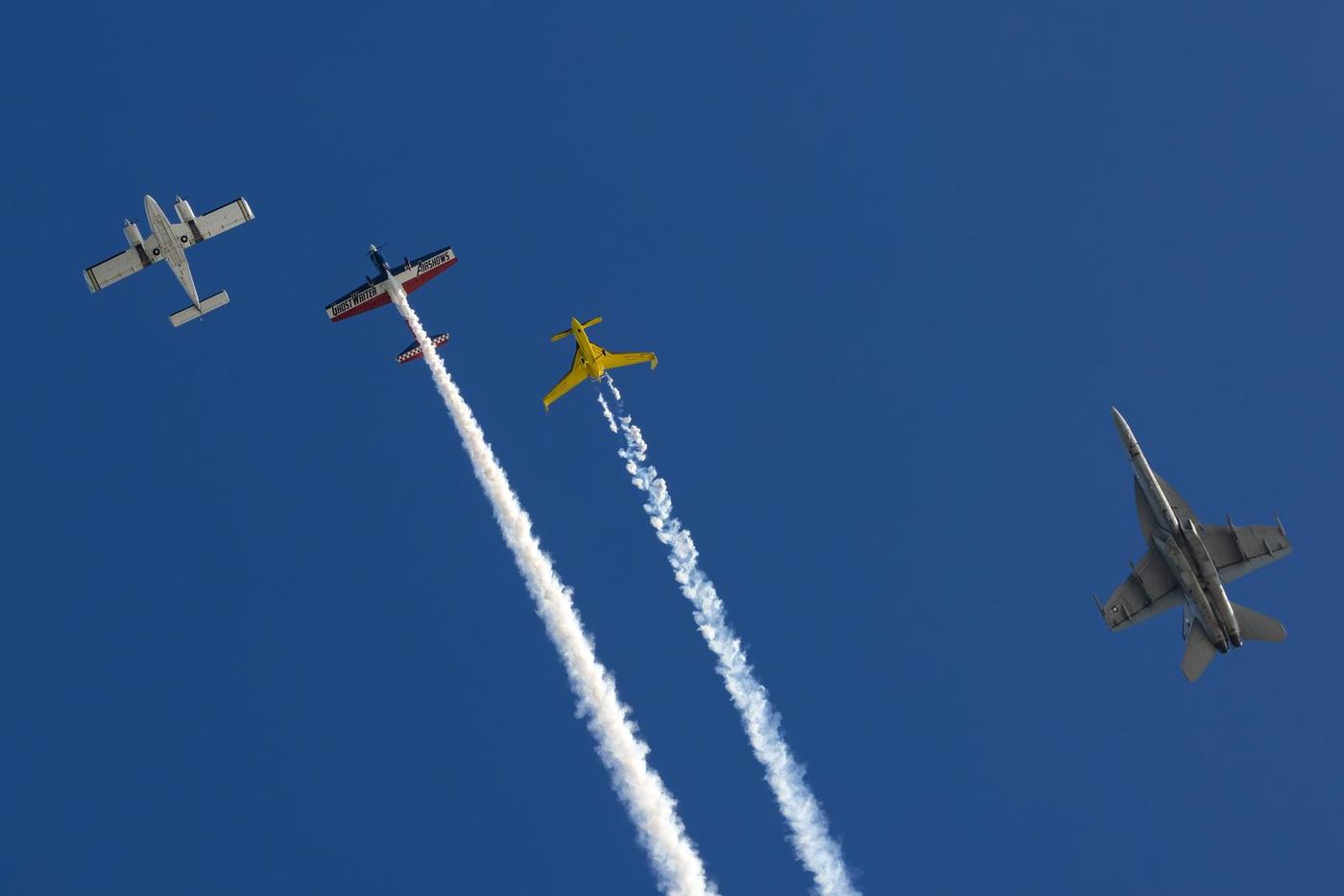 Aerobatic formation with smoke trails